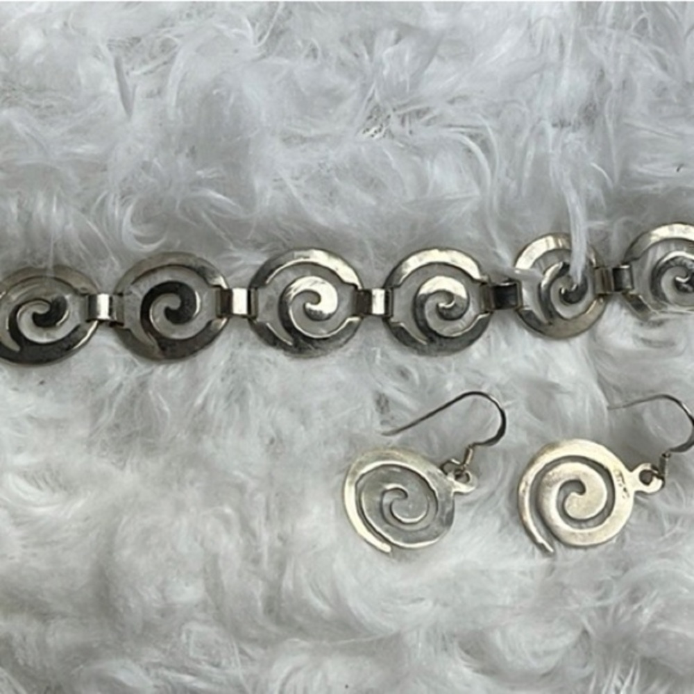 Sterling silver earrings (1” ish) and bracelet (8” long) set.